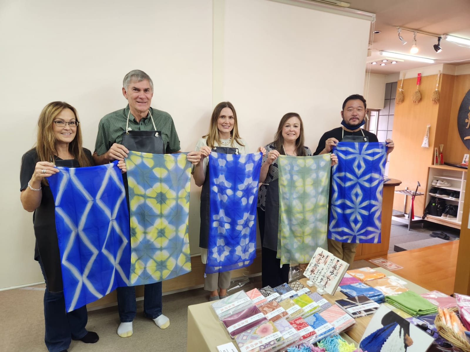 Guests displaying their handmade textiles during a cultural workshop