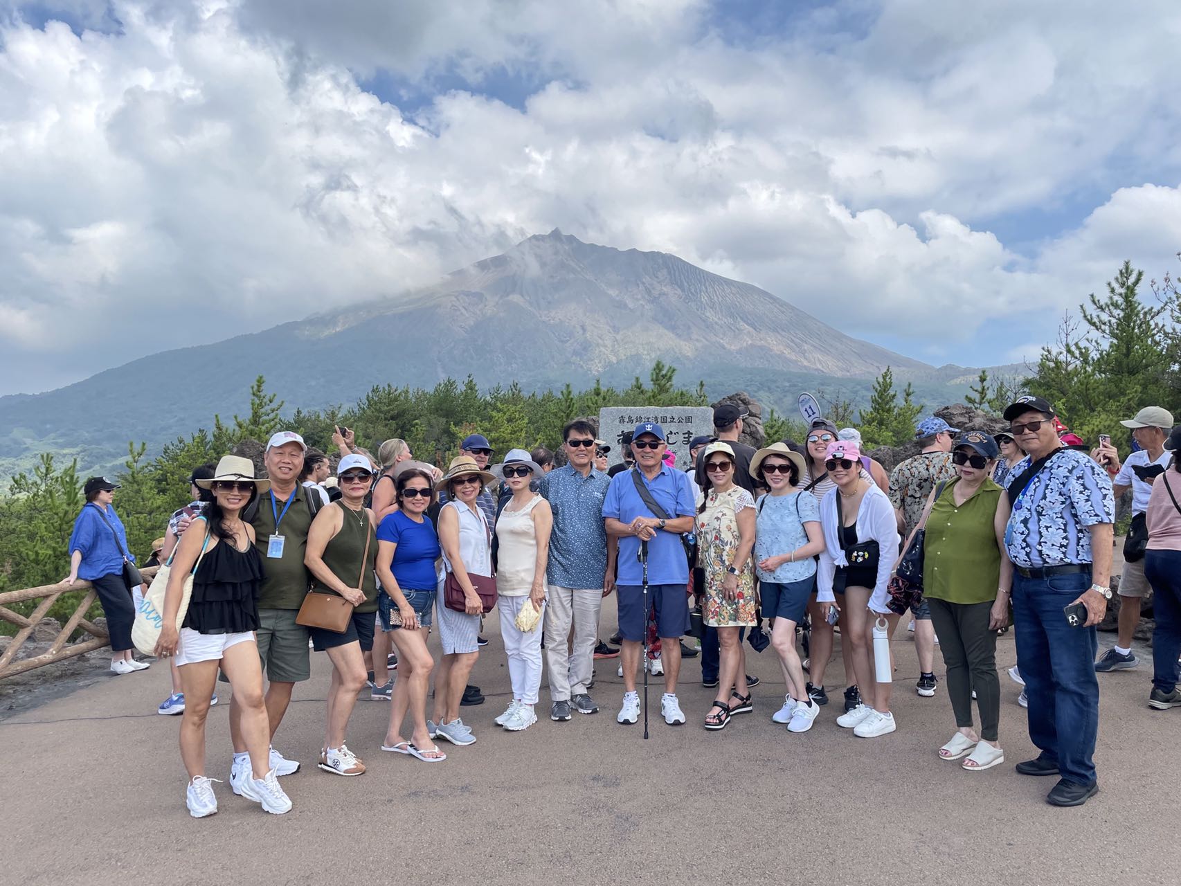 Guests posing together with a mountain backdrop