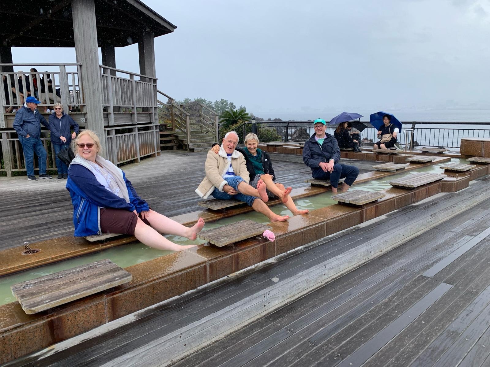 Guests relaxing at a seaside foot bath