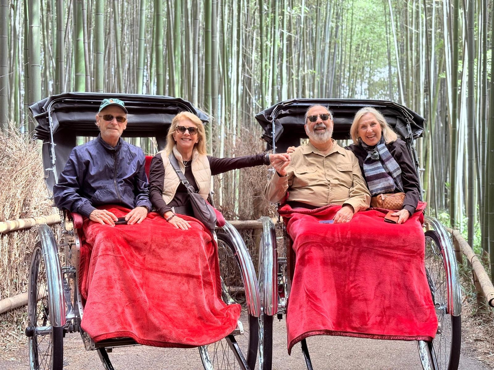 Guests taking a rickshaw ride through a bamboo grove