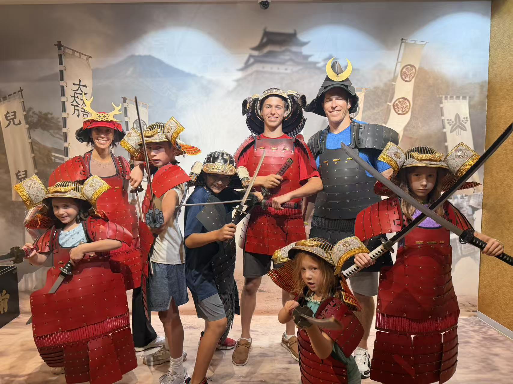 A family trying on samurai armour